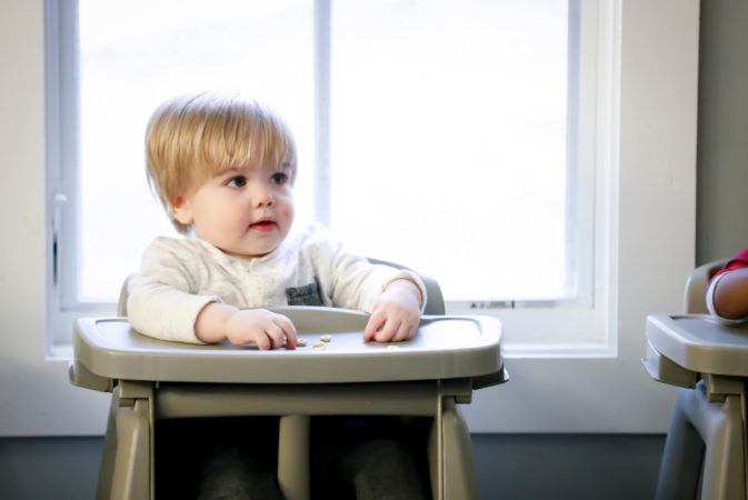 toddler_in_high-chair_winwood_childrens_center_brambleton_va-673x450