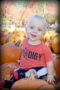 toddler_in_pumpkin_patch_cadence_academy_preschool_kenton_huntersville_nc-300x450