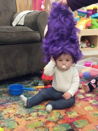toddler_in_purple_wig_cadence_academy_preschool_iowa_city_ia-336x450