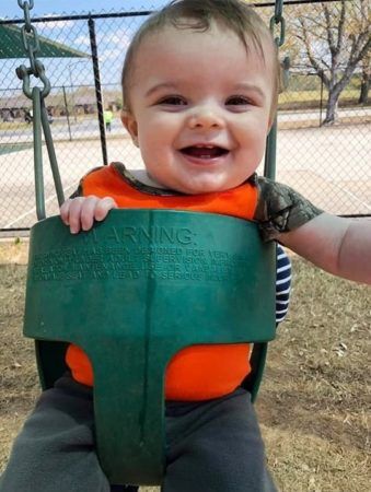 toddler_in_swing_at_the_bridge_learning_center_carrollton_ga-339x450