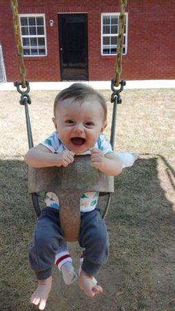 toddler_laughing_in_swing_gardening_activity_at_stonebridge_academy_bremen_ga2-253x450