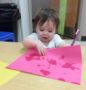 toddler_learning_how_to_use_toothbrush_cadence_academy_preschool_iowa_city_ia-430x450