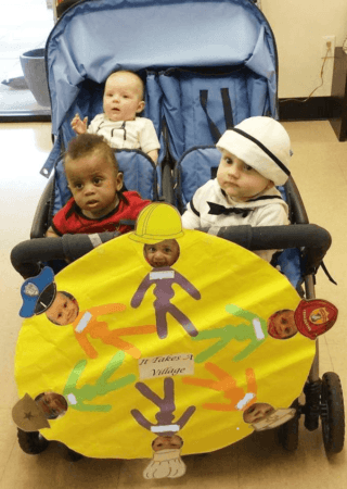 toddler_on_stroller_ride_at_cadence_academy_eastfield_huntersville_nc-320x450