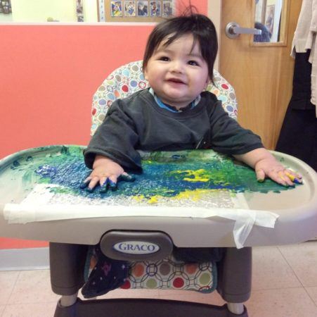toddler_painting_in_high_chair_next_generation_childrens_centers_westford_ma-451x450