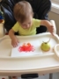 toddler_painting_with_an_apple_at_next_generation_childrens_centers_sudbury_ma-336x450
