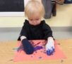 toddler_painting_with_socks_on_hands_next_generation_childrens_centers_beverly_ma-511x450