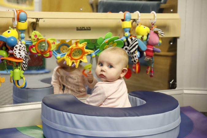 toddler_playing_in_cushioned_seat_winwood_childrens_center_leesburg_va-675x450