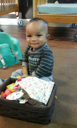 toddler_playing_with_basket_of_toys_sunbrook_academy_at_stockbridge_ga-269x450