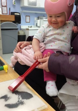 toddler_playing_with_magnet_at_next_generation_childrens_centers_marlborough_ma-315x450