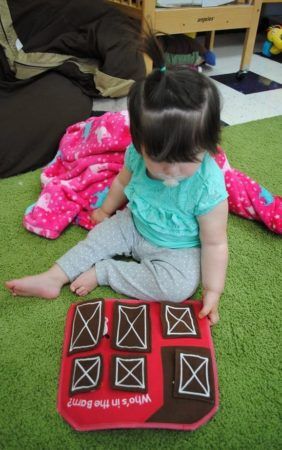 toddler_playing_with_plush_toy_at_phoenix_childrens_academy_private_preschool_lindsay-282x450