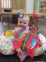 toddler_playing_with_rings_and_book_cadence_academy_preschool_cooper_point_olympia_wa-336x450