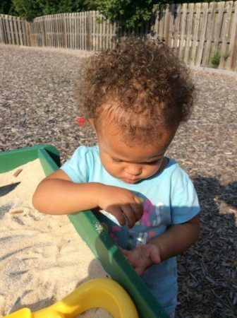 toddler_playing_with_sand_cadence_academy_northlake_charlotte_nc-336x450