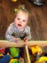 toddler_playing_with_small_toys_sunbrook_academy_at_bay_springs_villa_rica_ga-338x450