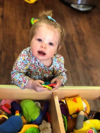 toddler_playing_with_small_toys_sunbrook_academy_at_bay_springs_villa_rica_ga-338x450