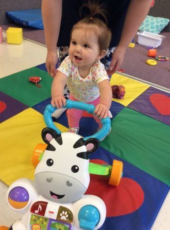 toddler_pushing_a_cow_toy_at_next_generation_childrens_centers_hopkinton_ma-333x450