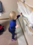 toddler_putting_spider_on_web_cadence_academy_preschool_urbandale_ia-336x450