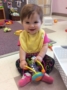 toddler_sitting_up_and_playing_with_toy_at_next_generation_childrens_centers_hopkinton_ma-333x450