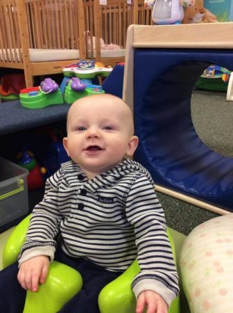 toddler_smiling_in_bumbo_seat_sunbrook_academy_at_barnes_mill_austell_ga-336x450