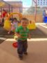 toddler_smiling_on_roof_area_cadence_academy_preschool_i_street_sacramento_ca-338x450