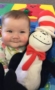 toddler_with_cat_in_the_hat_toy_at_cadence_academy_preschool_the_colony_tx-273x450