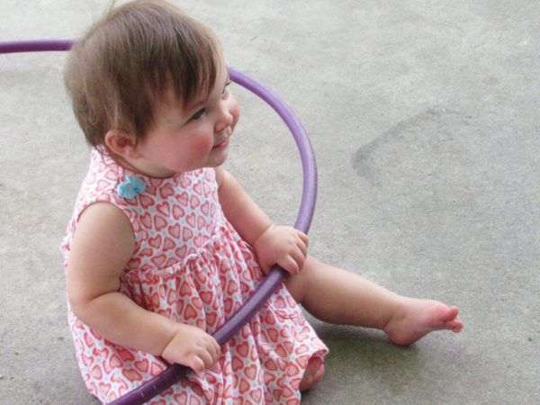 toddler_with_hula_hoop_cadence_academy_preschool_harbison_columbia_sc-600x450