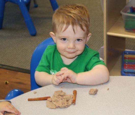 toddler_with_kinetic_sand_sunbrook_academy_at_stilesboro_kennesaw_ga-530x450