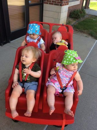 toddlers_in_bye-bye_buggie_cadence_academy_preschool_johnston_ia-336x450