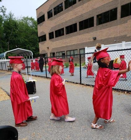 walking_to_pre-kindergarten_graduation_cadence_academy_preschool_lincoln_ri-422x450