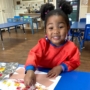 a child doing crafts indoors