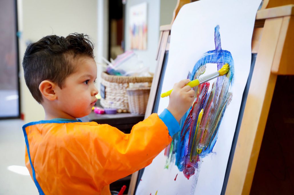 a child painting indoors