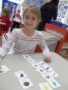 preschool_girl_doing_a_word_matching_activity_winwood_childrens_center_south_riding_va-338x450