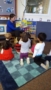 preschool_teacher_reading_to_students_winwood_childrens_center_south_riding_va-253x450