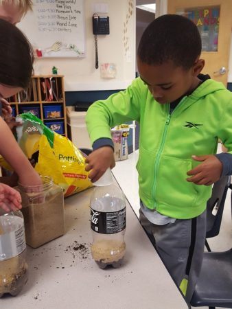 preschooler_making_a_2_liter_planter_winwood_childrens_center_south_riding_va-338x450