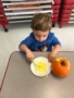 preschooler_painting_pumpkin_yellow_winwood_childrens_center_south_riding_va-338x450