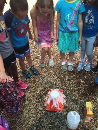 preschoolers_enjoying_volcano_on_playground_winwood_childrens_center_south_riding_va-338x450