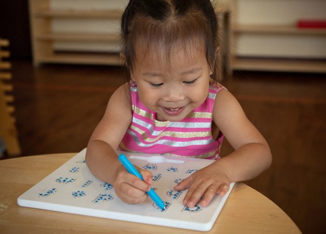 an image of a child doing a learning exercise