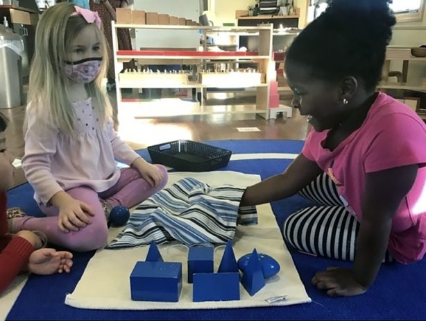 two children playing inside