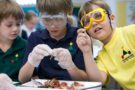 Children doing a science experiment indoors