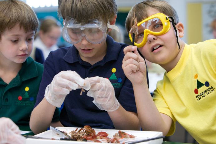 Children doing a science experiment indoors