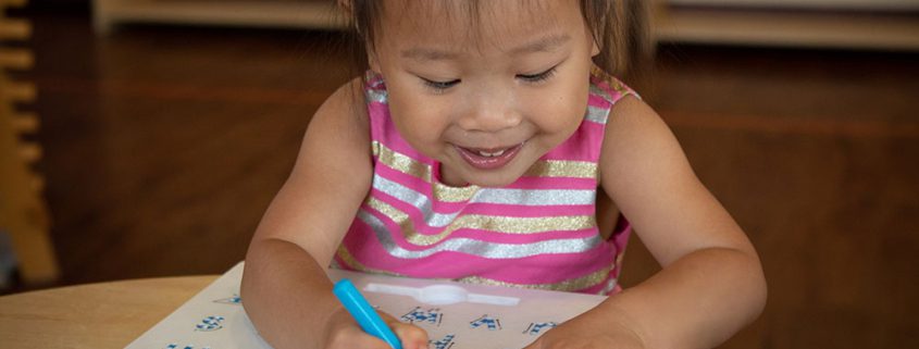 an image of a child doing a learning exercise