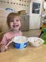 child smiling with banana split at fort thomas