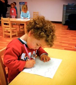 A child drawing indoors