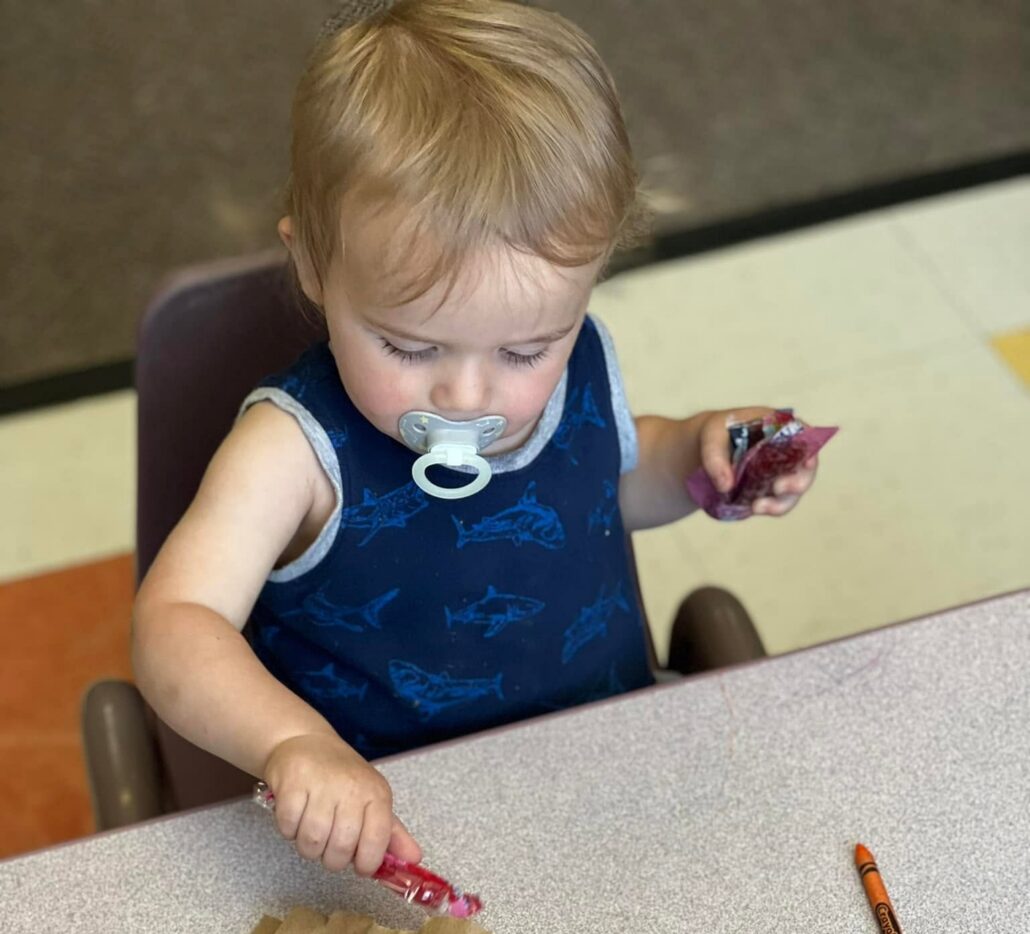 infant playing at cadence academy preschool draper
