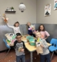 kids showing off artwork