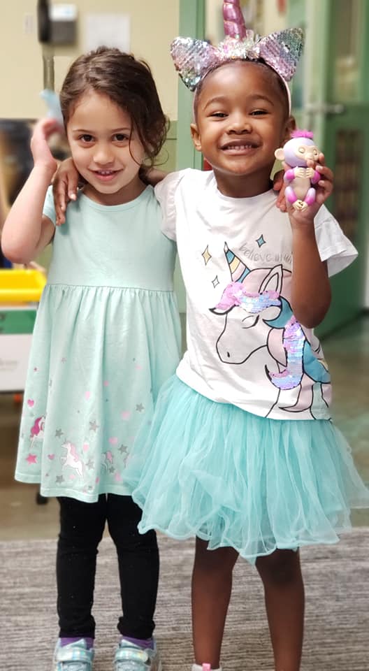children embracing indoors