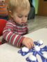a child doing crafts indoors