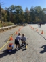 children riding the bike with each other at preschool and daycare at cadence academy preschool 452 south street
