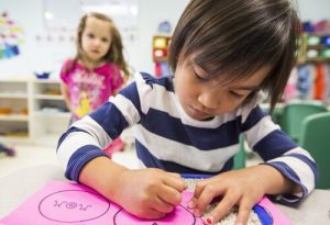 an image of a child doing crafts