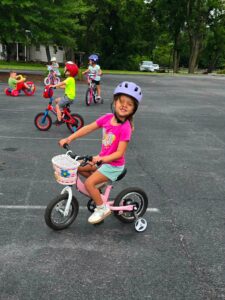 girl smiling on bike