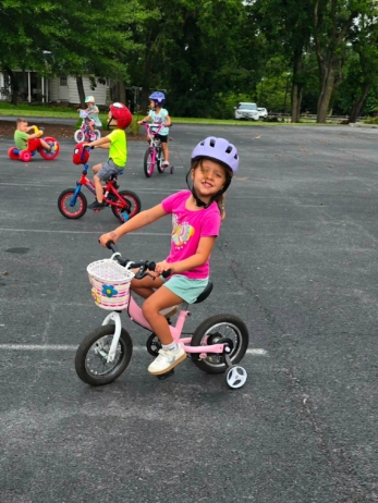 girl smiling on bike